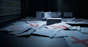 Stack of government budget papers with red rejection marks and crossed out allocations on office desk