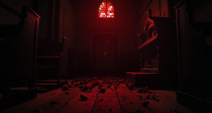 Dark church interior showing damaged wooden door and broken stained glass window with memorial flowers on floor