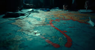 Strategic maps with territorial boundary markers and crossed-out buffer zone proposals on dark war room table surface