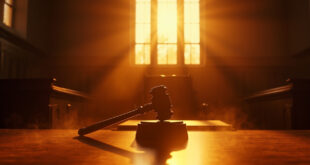 Empty judge's chair and gavel at wooden bench in vacant courtroom bathed in golden sunset light