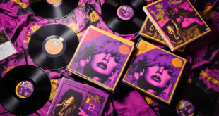 Colorful album covers stacked and fanned out showing dramatic courtroom-inspired artwork in purple and gold tones