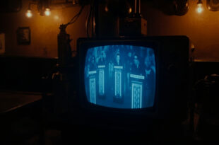 Vintage television screen glowing in dark pub interior showing quiz show results