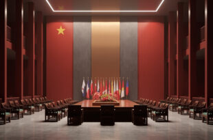 Empty diplomatic meeting room with ornate Chinese table, multiple national flags, and formal ceremonial chairs