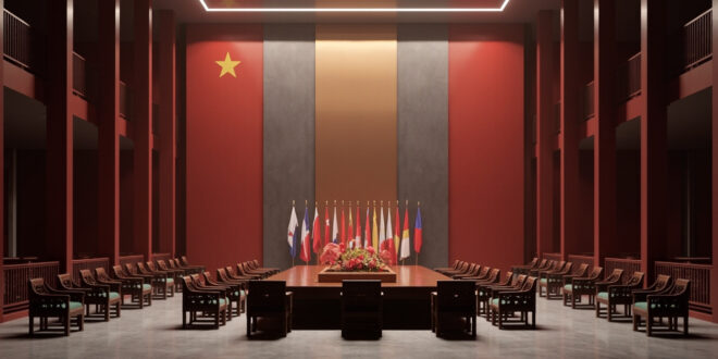 Empty diplomatic meeting room with ornate Chinese table, multiple national flags, and formal ceremonial chairs