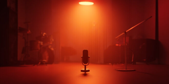 Professional recording studio with vintage microphone, mixing board, and musical instruments bathed in warm lighting.