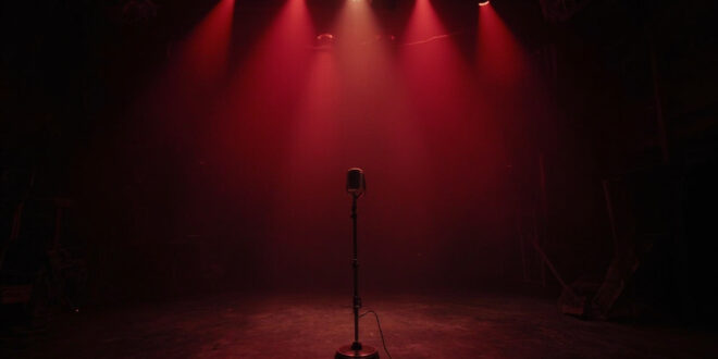 Empty television studio with single microphone stand on darkened stage, abandoned chairs and cameras in shadows
