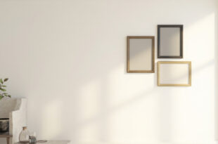 Elegant empty frames arranged on wall in modern home with sophisticated decor and warm lighting