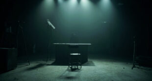 Empty television studio with abandoned anchor desk, microphone, and dark monitors in moody lighting