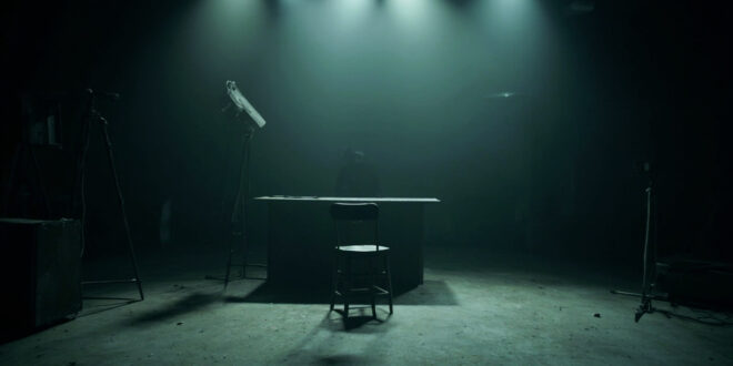 Empty television studio with abandoned anchor desk, microphone, and dark monitors in moody lighting