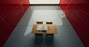 Empty classroom with wooden desks, open textbooks, and educational charts on walls