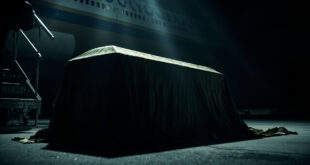 Draped mahogany coffin positioned on aircraft steps with official government plane in background on airport tarmac