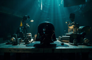 Dark helmet prop and vintage film equipment arranged on movie studio table under dramatic lighting