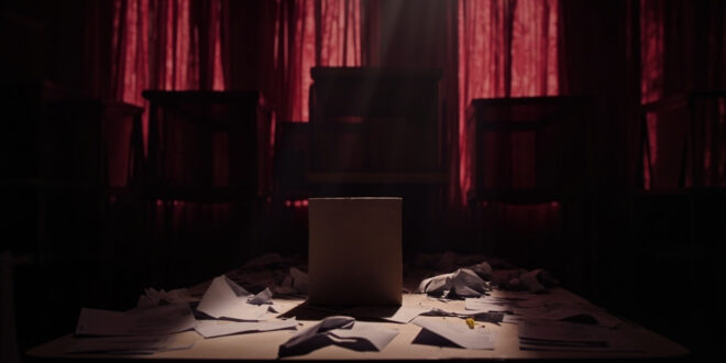 Empty voting booth with scattered ballot papers and official seals in dark municipal office with closed stations