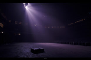 Empty concert stage with dramatic lighting in darkened stadium venue, abandoned briefcase visible on floor
