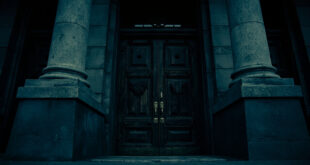 Classical government building entrance with heavy wooden doors and brass fixtures against overcast sky