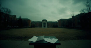 Empty university podium stands alone on deserted campus courtyard with scattered papers on ground.