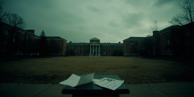 Empty university podium stands alone on deserted campus courtyard with scattered papers on ground.