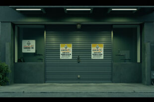 Closed storefront with metal security gates in tropical commercial area, showing an empty cannabis dispensary
