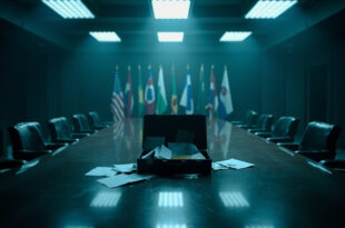 Open diplomatic briefcase with documents scattered on conference table under harsh lighting