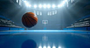 Orange basketball frozen mid-air approaching hoop in empty championship arena with dramatic overhead lighting