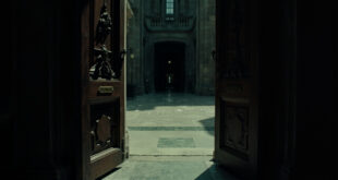 Ornate government office doors standing open with scattered official papers on polished floors