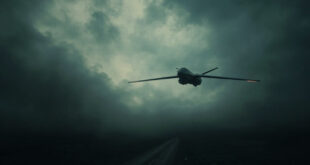 Military drone silhouette against dark stormy sky with dramatic lighting and threatening atmosphere