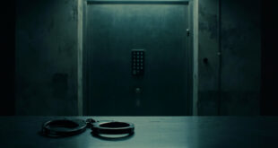 Empty handcuffs on steel interrogation table in stark government facility