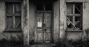 Empty abandoned house with boarded windows and weathered facade under gray sky