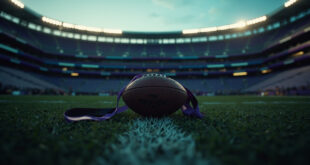 Football on empty stadium field with purple Ravens endzone and memorial ribbons in dramatic lighting.