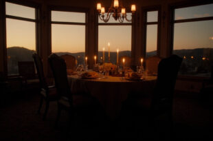 Elegant dining room with set table, empty chairs, and soft lighting in a Hidden Hills home interior