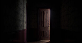 A heavy wooden door slightly ajar in a dim hallway with vintage wallpaper, light filtering through the gap