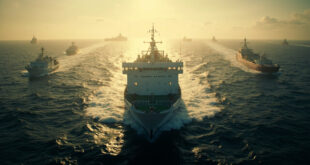 White humanitarian vessel navigating dark choppy waters with military ships visible on horizon at dawn