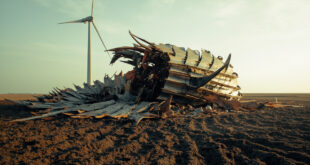 Shattered wind turbine nacelle and broken rotor blades scattered across agricultural field near intact tower