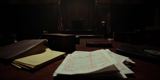 Closed briefcase with stacked legal documents and yellow notepad on dark wooden courtroom table in dramatic lighting
