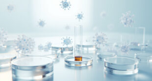 Glass test tube with liquid sample on white laboratory surface under sterile lighting