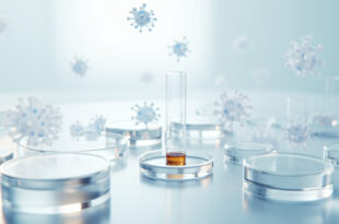 Glass test tube with liquid sample on white laboratory surface under sterile lighting