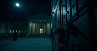 Chained doors of a neoclassical government building under dramatic lighting with empty plaza