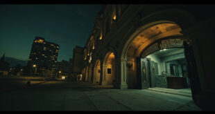 Exterior view of closed luxury hotel building in Cairo with darkened windows and empty entrance area at twilight