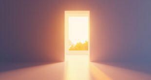Open doorway with warm golden light streaming into minimalist interior space