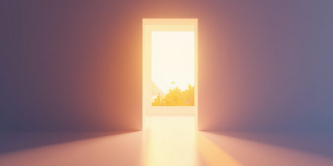 Open doorway with warm golden light streaming into minimalist interior space