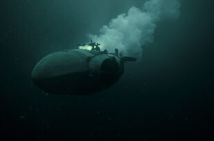Torpedo-shaped underwater drone emerging from dark ocean depths with trailing bubbles and dim light penetration