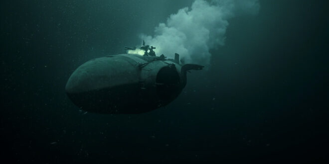 Torpedo-shaped underwater drone emerging from dark ocean depths with trailing bubbles and dim light penetration